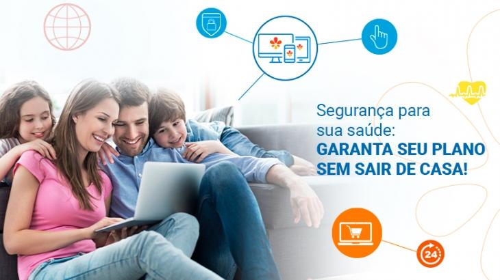 família reunida utilizando computador 