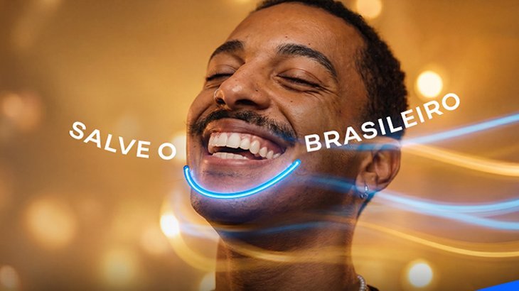Homem sorrindo destaca a campanha Salve o Sorriso Brasileiro.